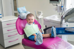 Little boy in dentistry, sitting in chair