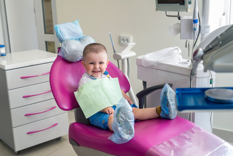 Little boy in dentistry, sitting in chair