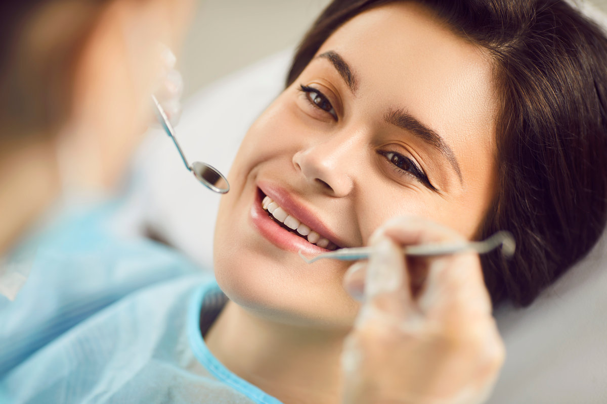 Dental clinic oral health treatment, dentist exam, teeth, gums care for smiling woman healthy at doctor visit, demonstrating whitening teeth procedure result, satisfied with stomatology clinic service